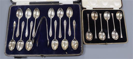 A George V cased set of twelve silver teaspoons and pair of sugar tongs and a cased set of six silver teaspoons.